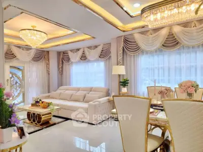 Luxurious living room with elegant decor and chandelier lighting