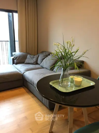 Cozy living room with modern gray sofa and stylish decor