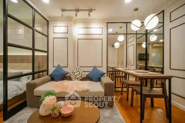Stylish modern living room with cozy sofa and elegant dining area