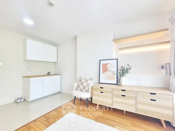 Bright and modern living room with stylish furniture and minimalist decor.