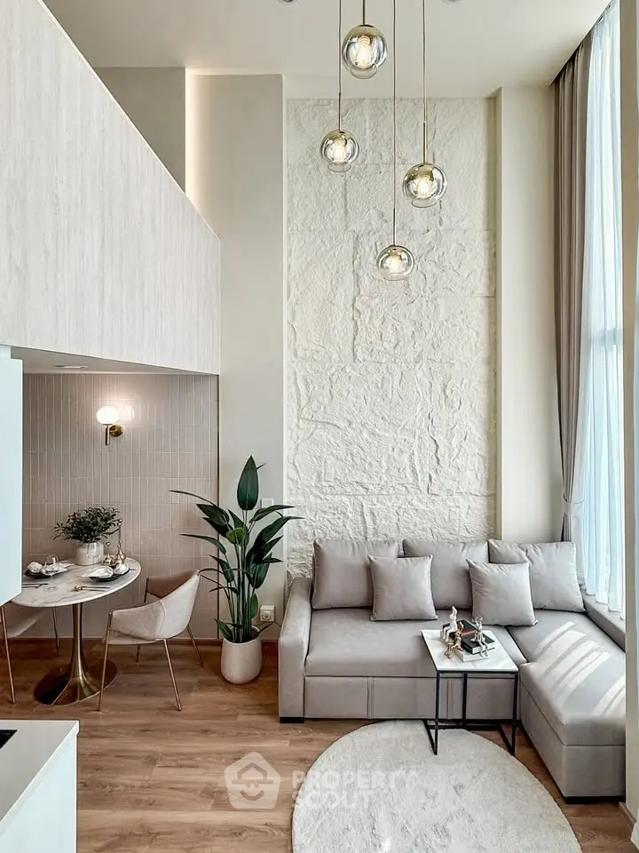 Modern living room with high ceilings and elegant decor