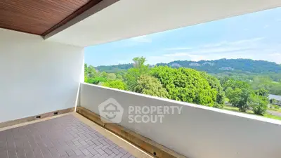 Spacious balcony with stunning green view in modern apartment