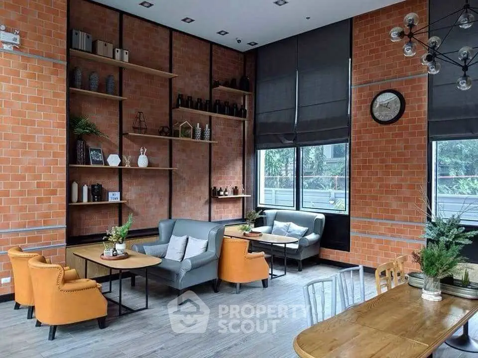 Stylish modern living room with brick walls and cozy seating area, perfect for relaxation.