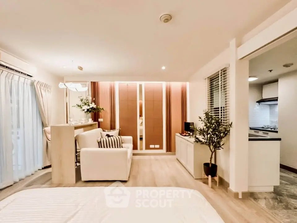 Modern open-plan living room with stylish decor and natural light