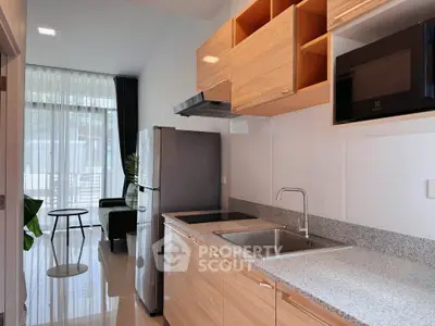 Modern kitchen with sleek appliances and open layout in a bright apartment