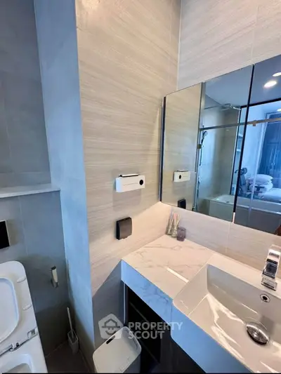 Modern bathroom with sleek fixtures and elegant marble countertop