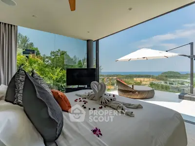 Luxurious bedroom with stunning ocean view and elegant decor in a modern villa.