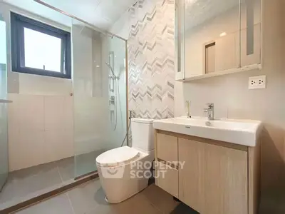 Modern bathroom with glass shower and stylish vanity