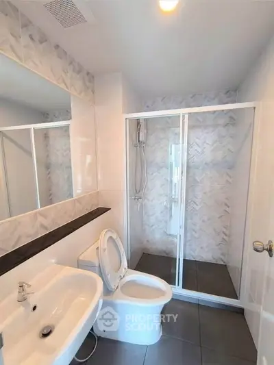 Modern bathroom with sleek shower and stylish tile design