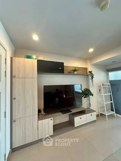Modern living room with sleek TV unit and stylish decor