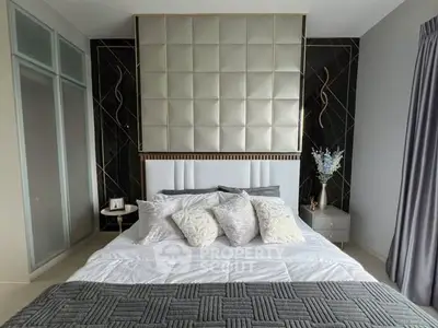 Luxurious bedroom with elegant decor and plush bedding in modern apartment