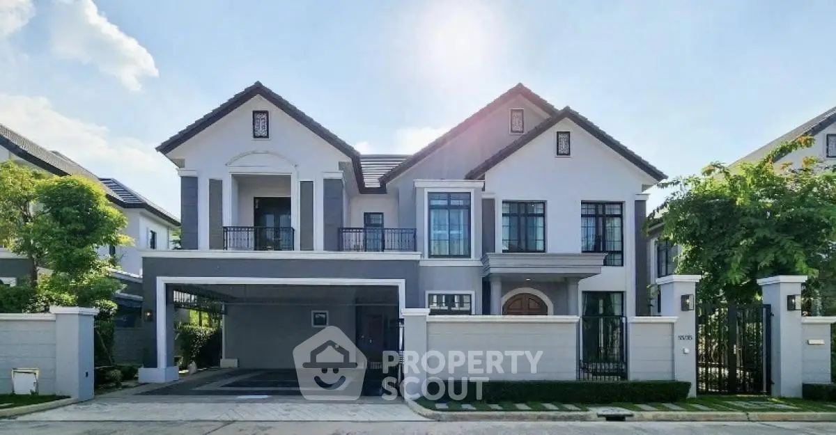 Luxurious modern two-story house with spacious driveway and elegant facade