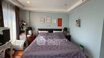 Cozy bedroom with elegant decor and ample natural light