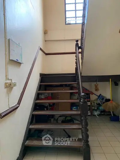 Charming staircase with storage space under steps, perfect for maximizing small home areas.