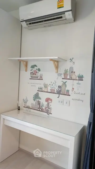 Charming study nook with wall art and air conditioning in modern apartment