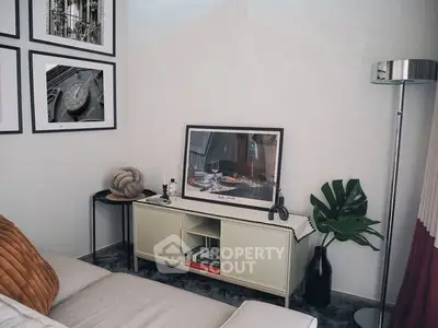 Stylish living room with modern decor and cozy seating area.