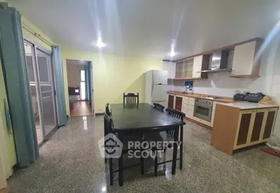 Spacious kitchen with dining area and modern appliances