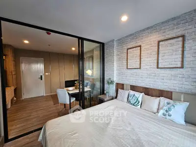 Modern bedroom with glass partition and stylish decor in urban apartment