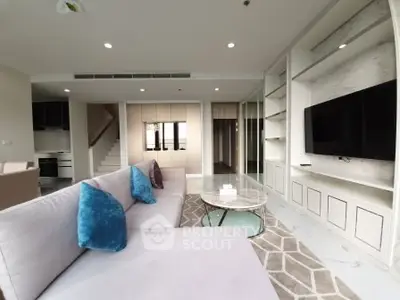 Luxurious modern living room with plush sofa and built-in entertainment center