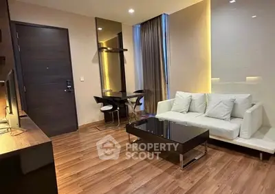 Modern living room with sleek furniture and ambient lighting