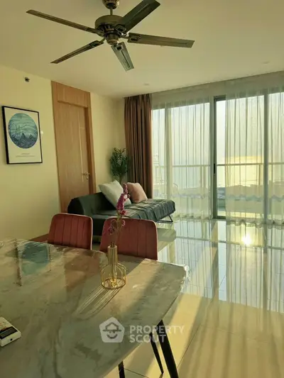 Spacious living room with modern decor and stunning sea view