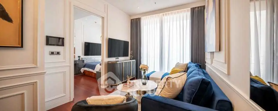 Luxurious living room with elegant decor and large windows for natural light.