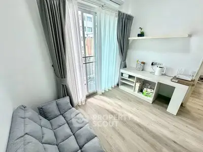 Bright and cozy living room with modern decor and balcony access