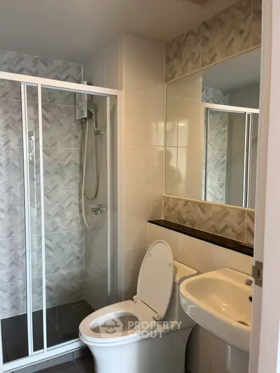 Modern bathroom with glass shower and sleek fixtures