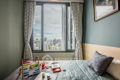 Cozy bedroom with city view, featuring educational toys and modern decor.