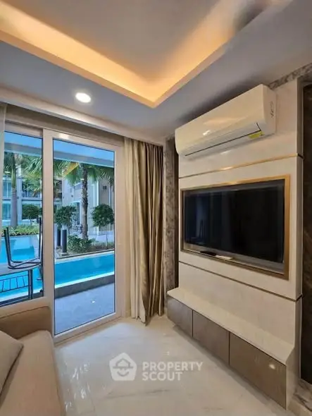 Luxurious living room with pool view and modern air conditioning unit