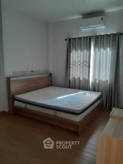 Cozy bedroom with natural light and modern furnishings