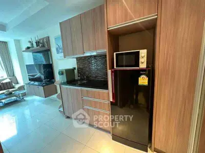 Modern kitchen with sleek cabinets and appliances in a stylish apartment