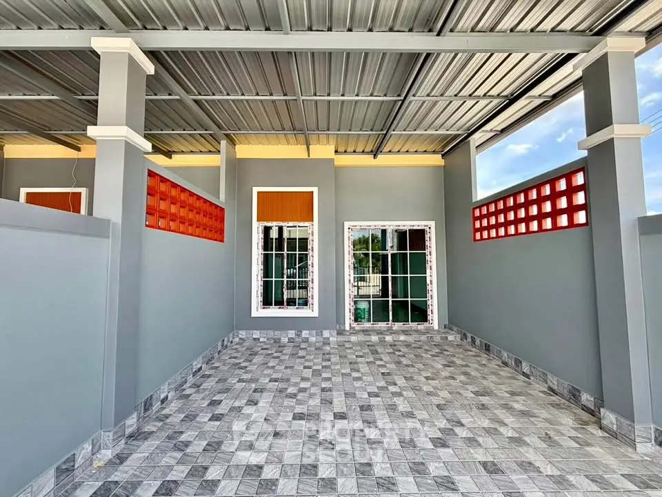 Modern covered parking area with tiled flooring and sleek design