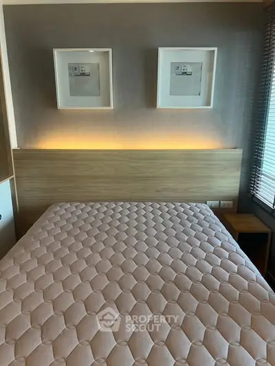 Modern bedroom with stylish decor and cozy lighting, perfect for relaxation.