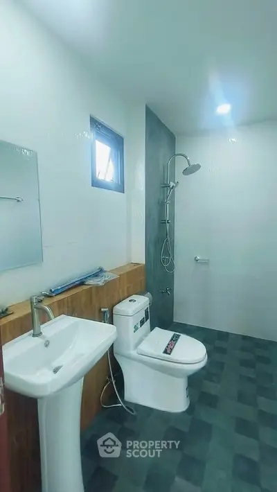 Modern bathroom with sleek fixtures and walk-in shower