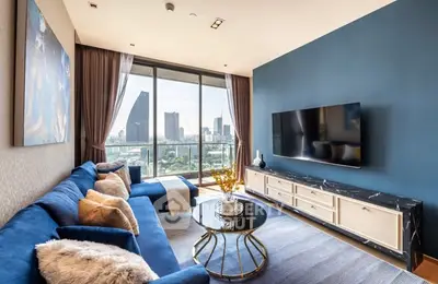 Luxurious living room with stunning city view and modern blue decor
