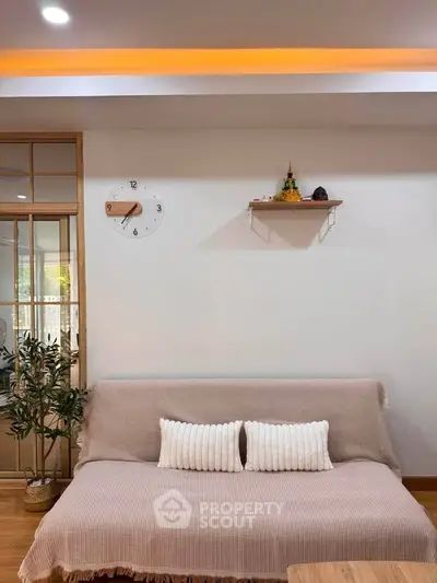 Cozy living room with stylish decor and comfortable seating, perfect for relaxation.