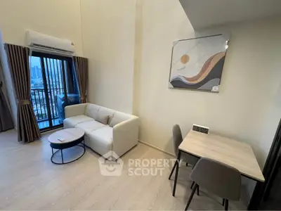 Modern living room with balcony view in high-rise apartment