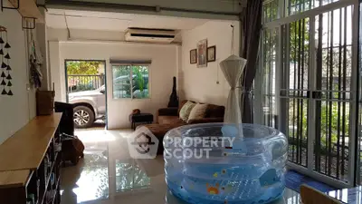 Spacious living room with modern decor and large windows for natural light.