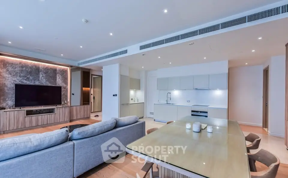 Spacious modern living room with open kitchen and elegant decor