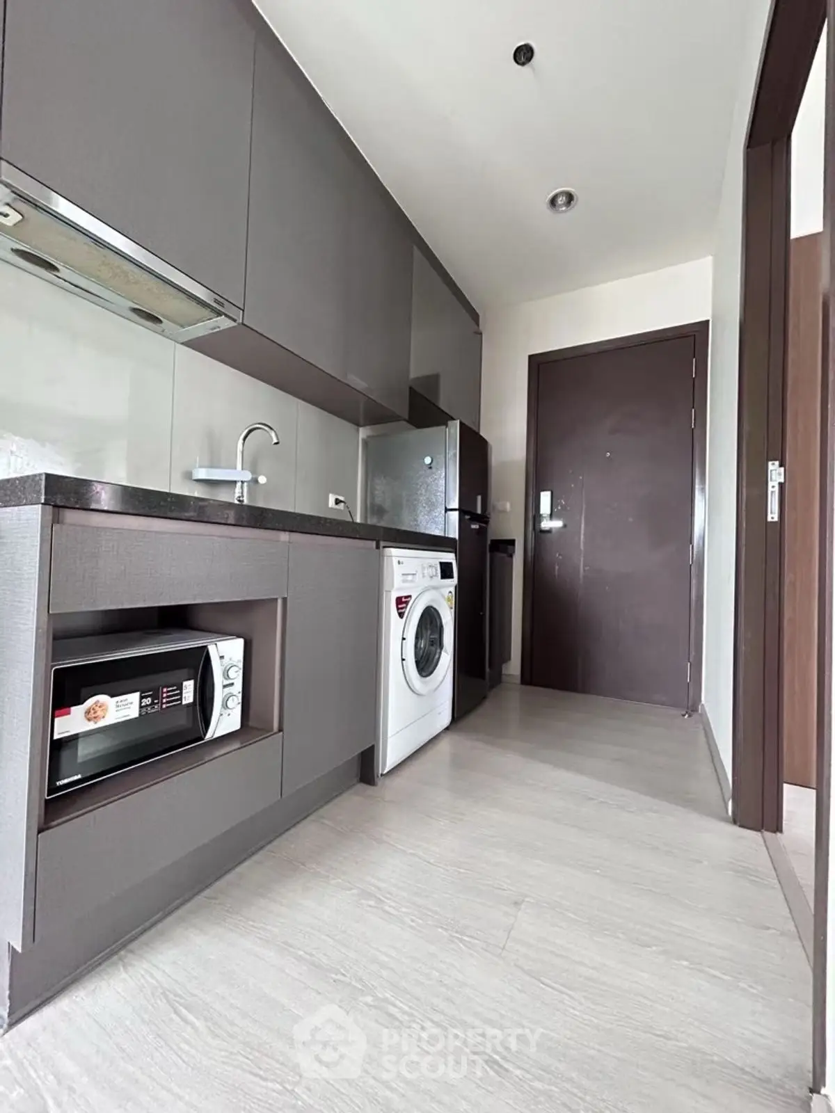Modern kitchen with sleek cabinetry and built-in appliances