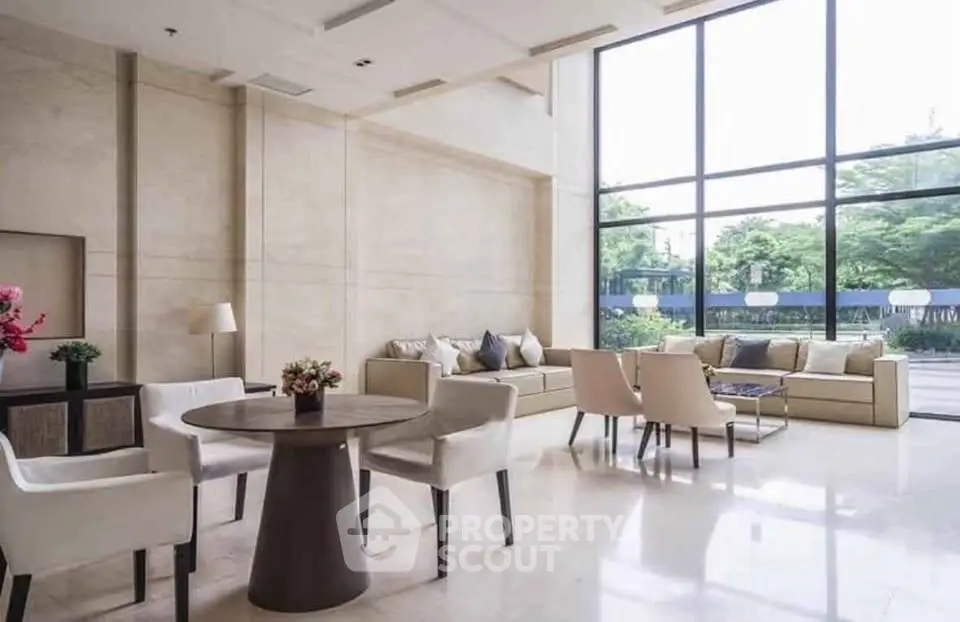 Luxurious modern living room with large windows and elegant furniture