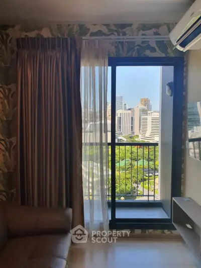 Chic urban apartment with balcony offering stunning cityscape views, perfect for modern living.