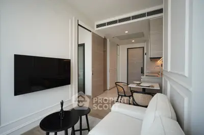 Modern living room with sleek design and open kitchen layout in luxury apartment