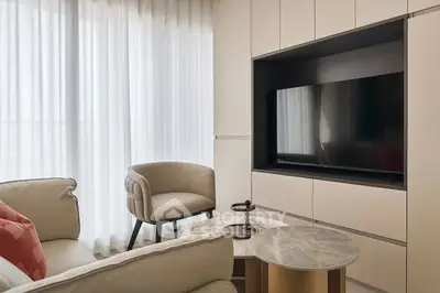 Modern living room with sleek TV unit and stylish furniture