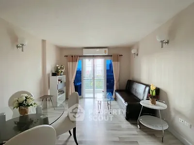 Spacious living room with modern decor and natural light