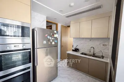 Modern kitchen with stainless steel appliances and sleek cabinetry