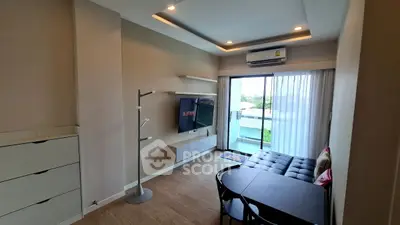 Modern living room with stylish decor and balcony view