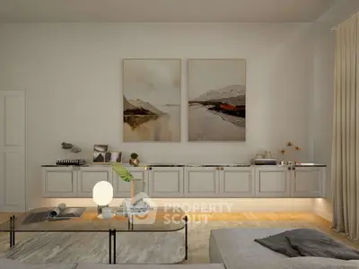 Elegant living room with modern decor and stylish artwork, featuring a cozy seating area and ambient lighting.