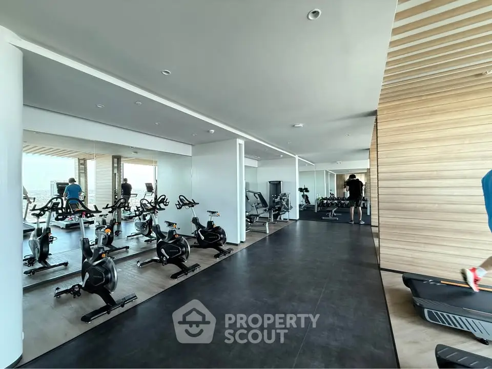 Modern gym with state-of-the-art equipment and sleek design, perfect for fitness enthusiasts.